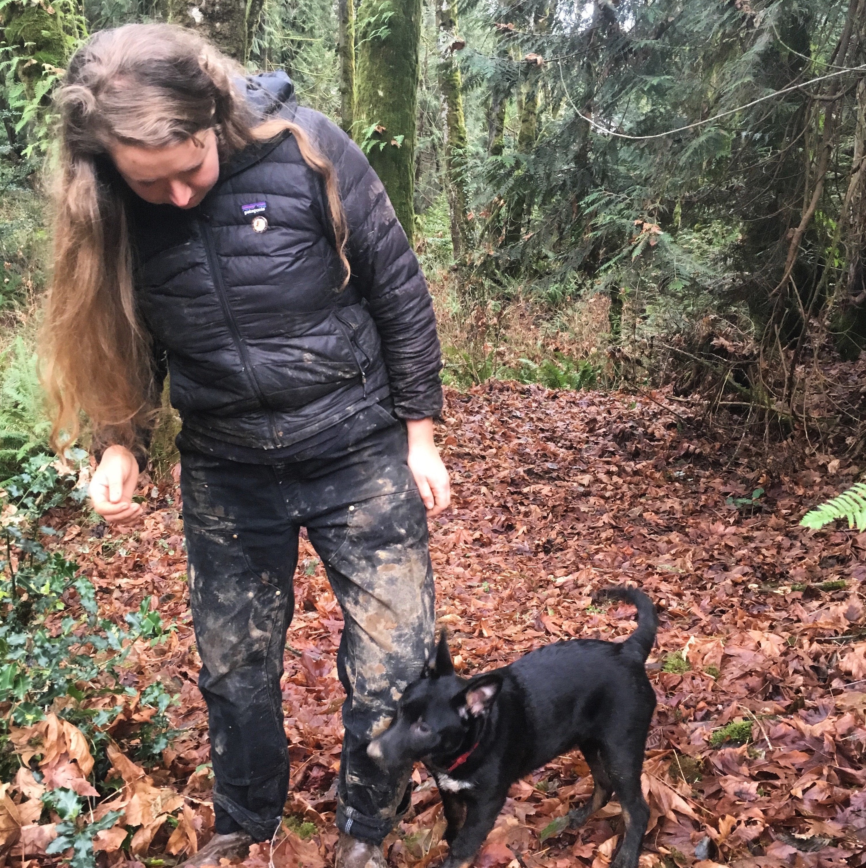 Muddy woman and muddy puppy