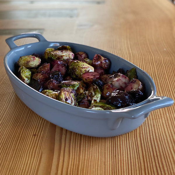 Roasted Brussles sprouts with blueberry marinade in blue crock